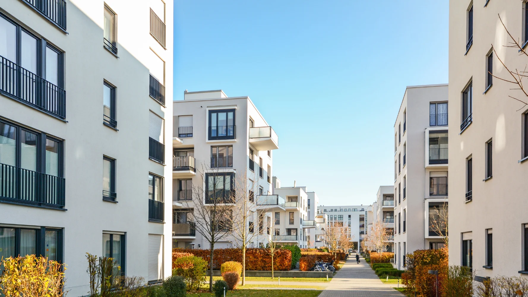 A modern apartment building, a property where construction defect attorneys handle claims for faulty plumbing and structural settlement.