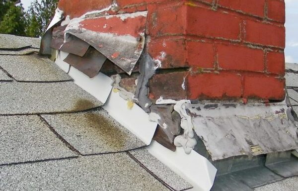 Significant vertical and horizontal cracking in a party wall with peeling plaster, a common structural failure investigated by condo construction defect attorneys.